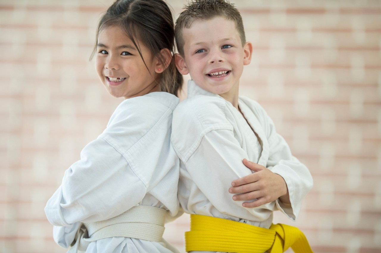 Martial arts instructor with kids