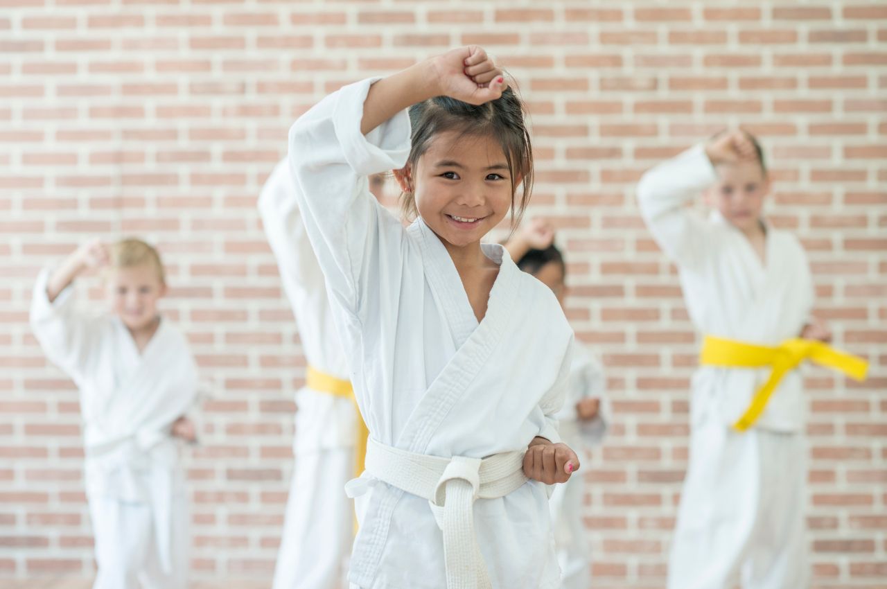 Martial arts instructor with kids
