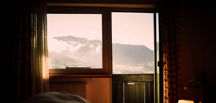 Morning sunlight coming through a window, illustrating the importance of exposure to natural light for regulating sleep patterns. Morning sunlight coming through a window, illustrating the importance of exposure to natural light for regulating sleep patterns.