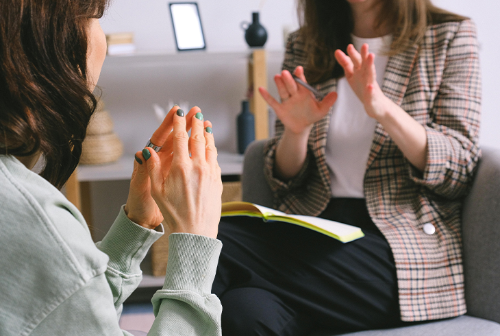 Therapist talking to a client, providing support for alcohol and anxiety recovery. Therapist talking to a client, providing support for alcohol and anxiety recovery.