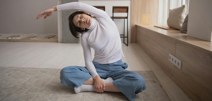 Person stretching to relieve stress, showcasing gentle relaxation techniques. Person stretching to relieve stress, showcasing gentle relaxation techniques.