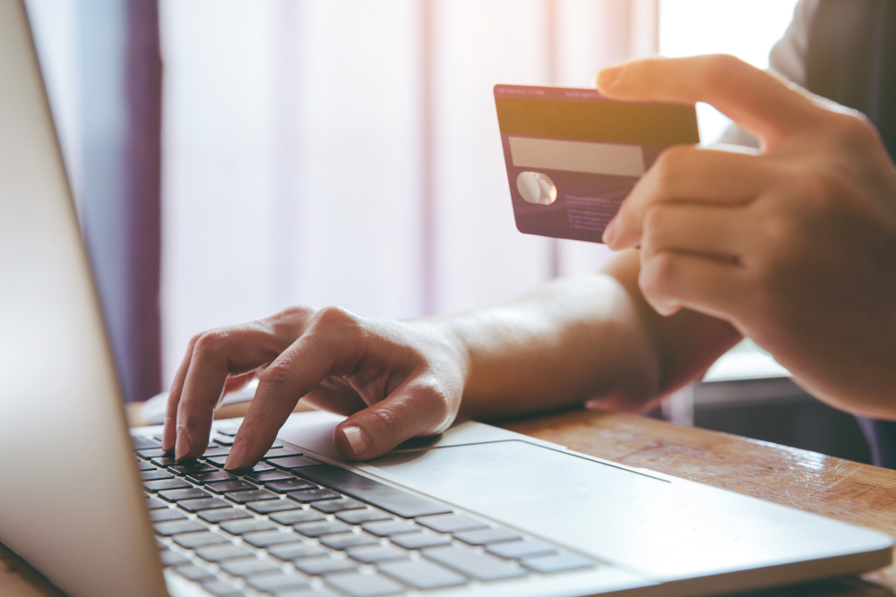man-typing-credit-card-details-online-payment-laptop man-typing-credit-card-details-online-payment-laptop