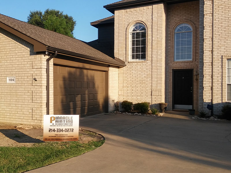 a house with a sign in front of it