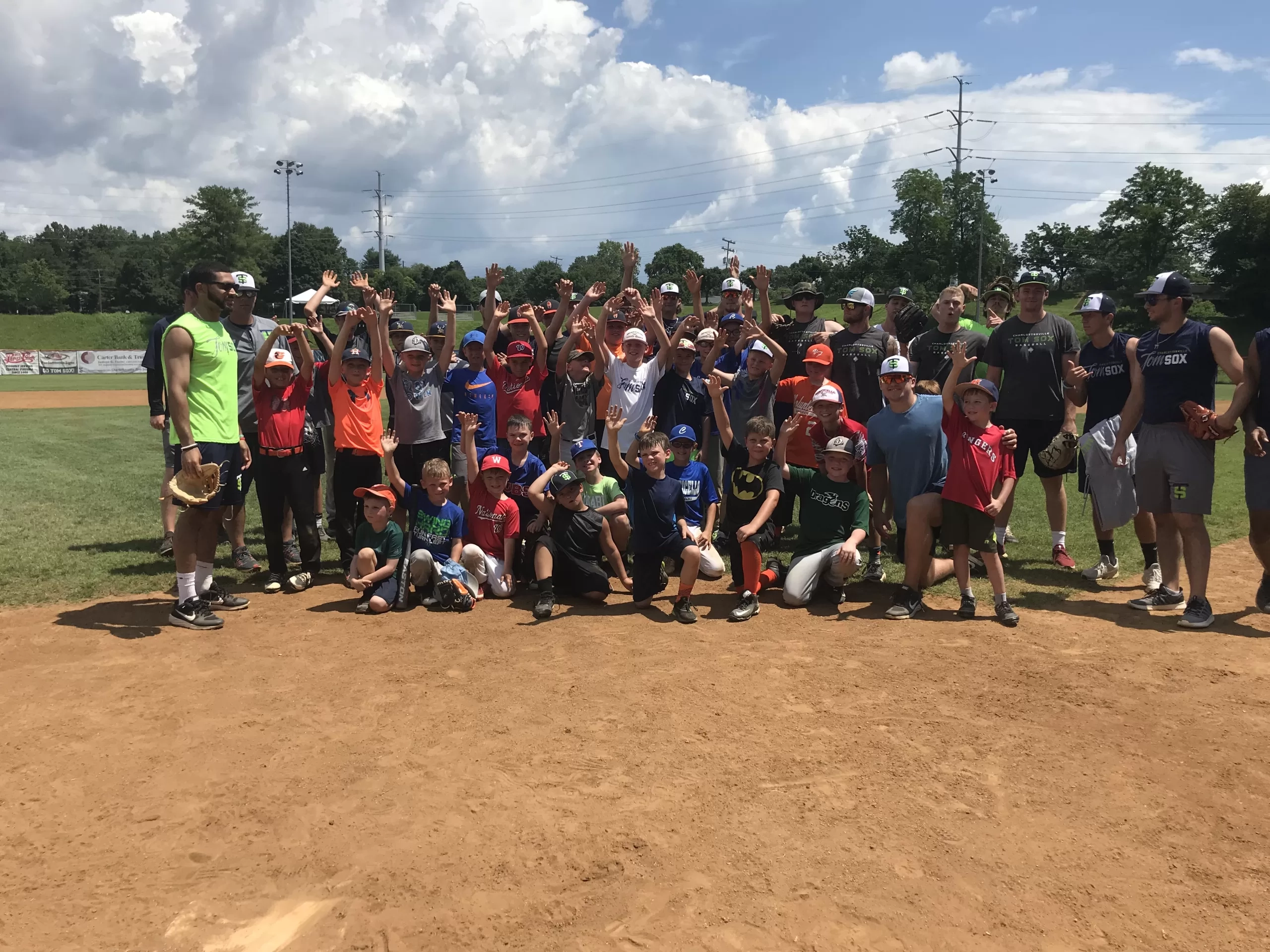 Tom Sox Summer Camp - Kids and coaches on the baseball field
