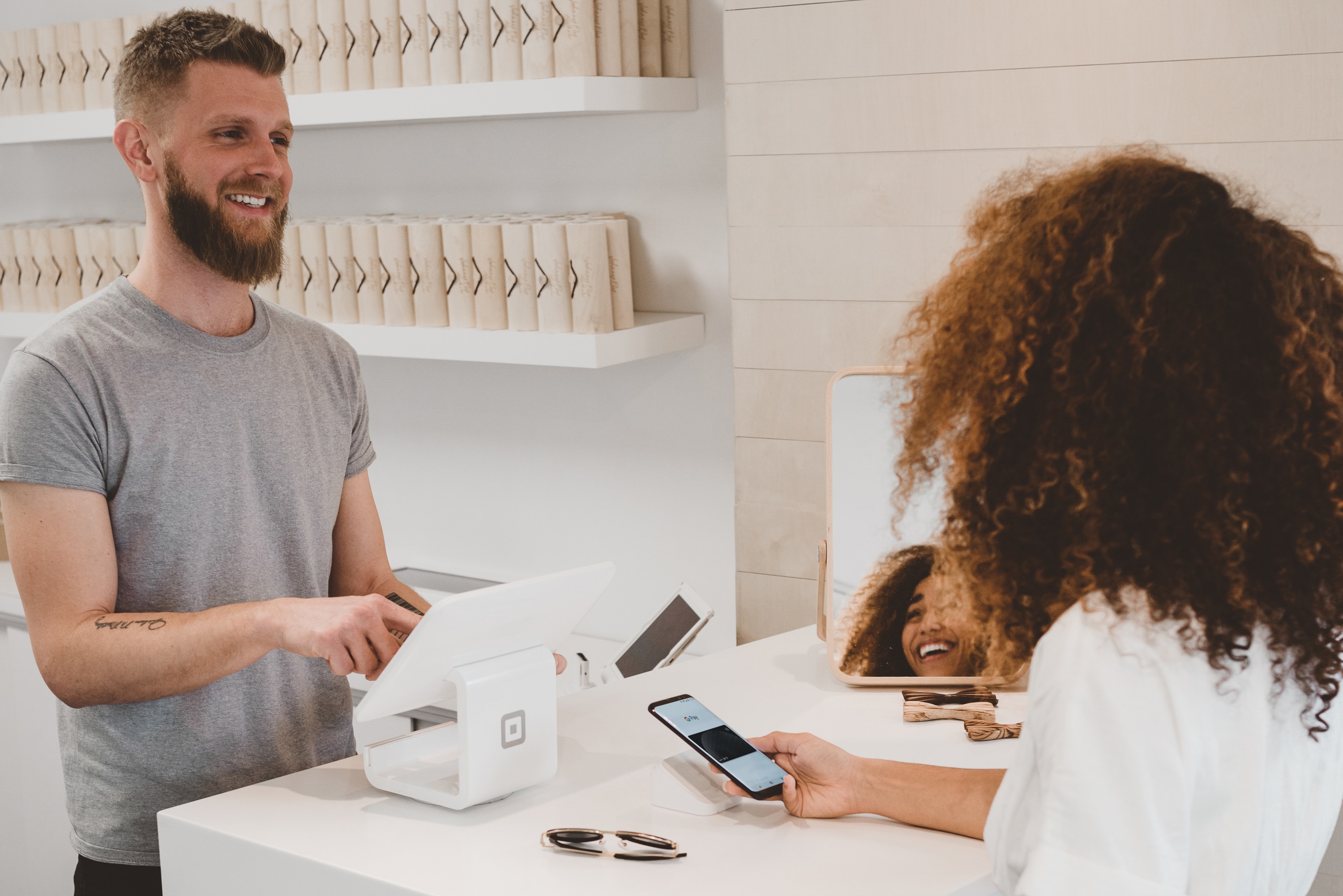 customer at front desk paying