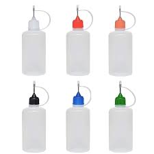 Six translucent plastic squeeze bottles with different colored caps (white, red, orange, black, blue, and green) arranged in two rows. Each bottle has a nozzle with a small cap attached by a plastic loop, typically used for dispensing liquids such as glue or paint.