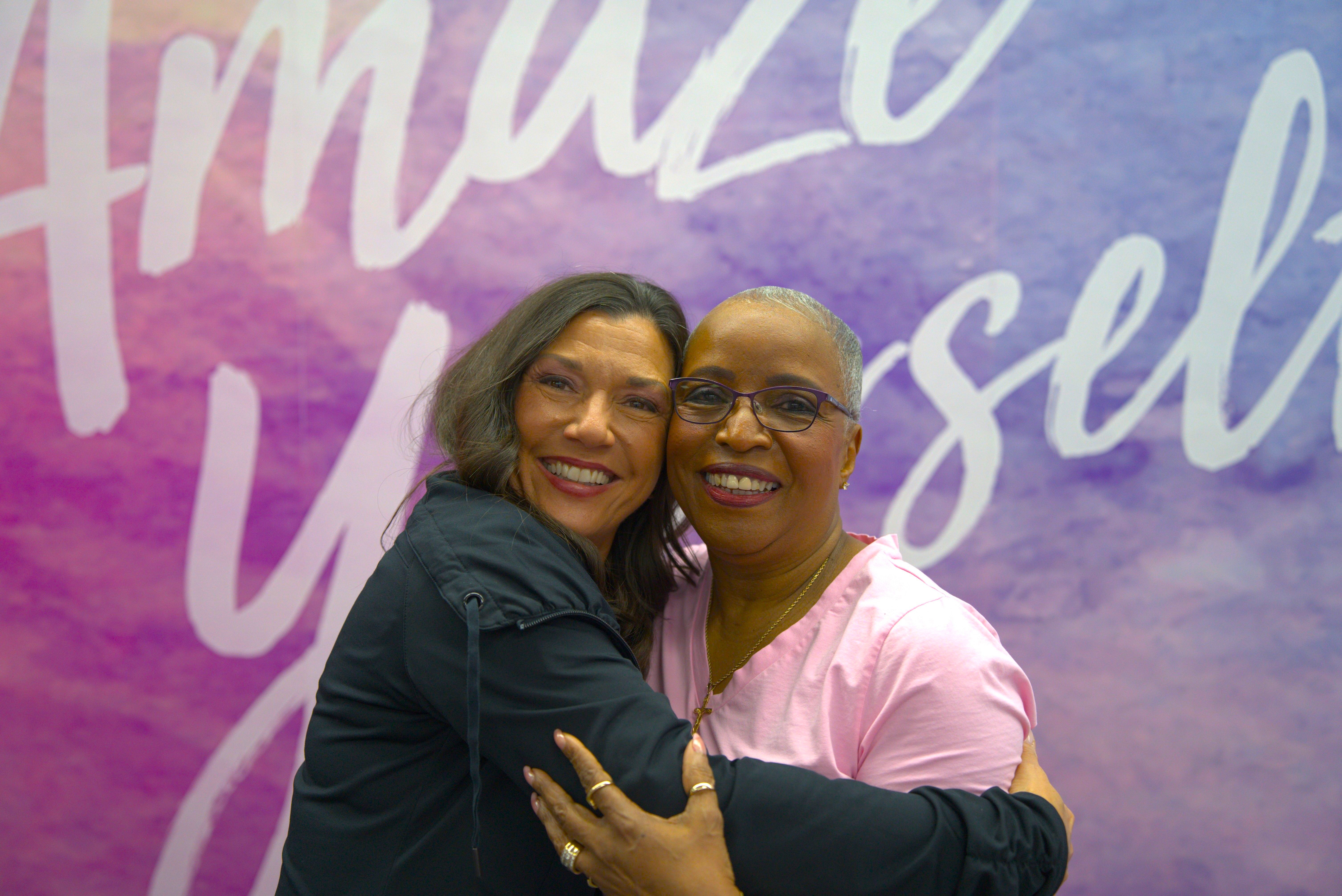 Women hugging at a Curves club