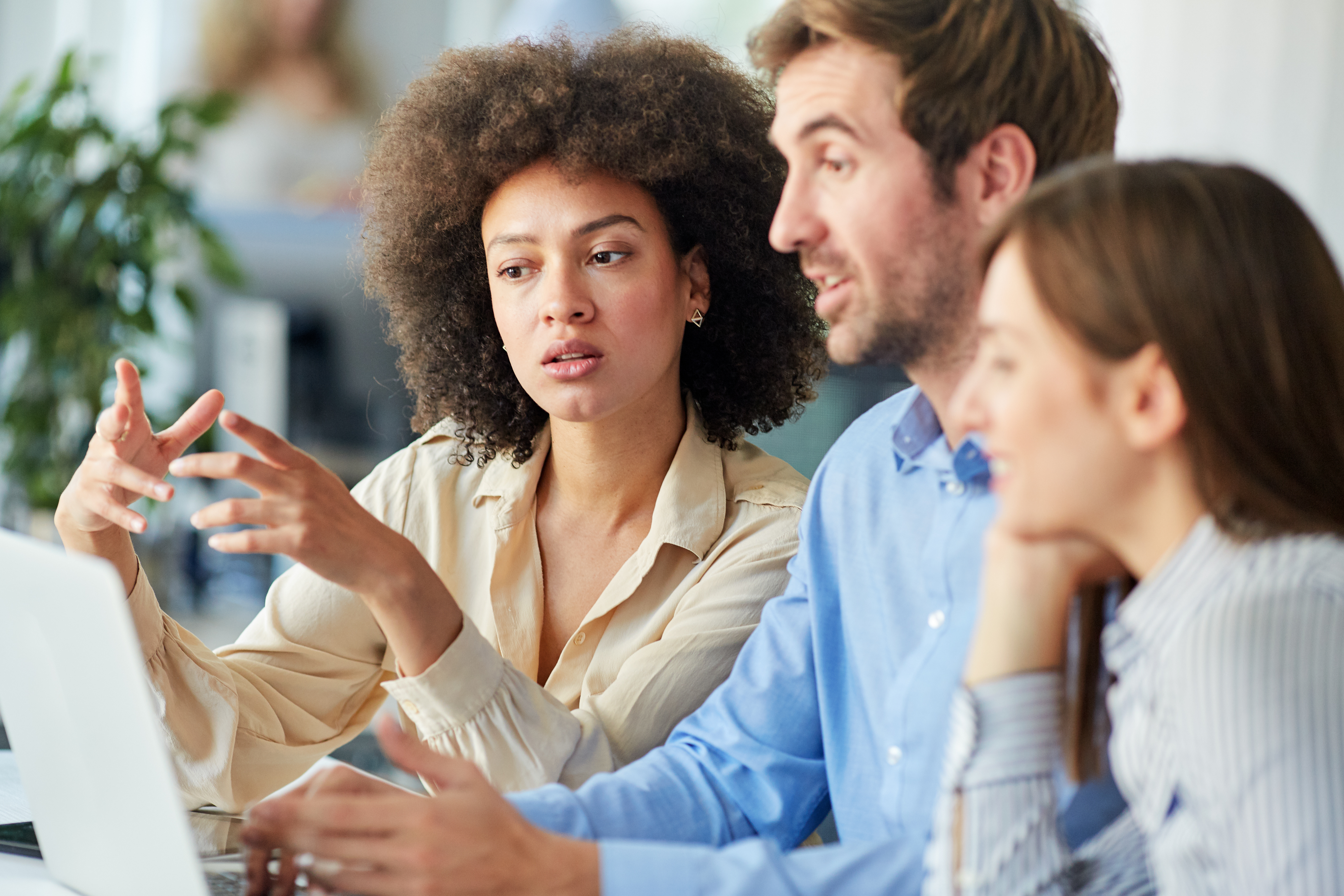 Diverse group reviewing policies to ensure inclusivity.