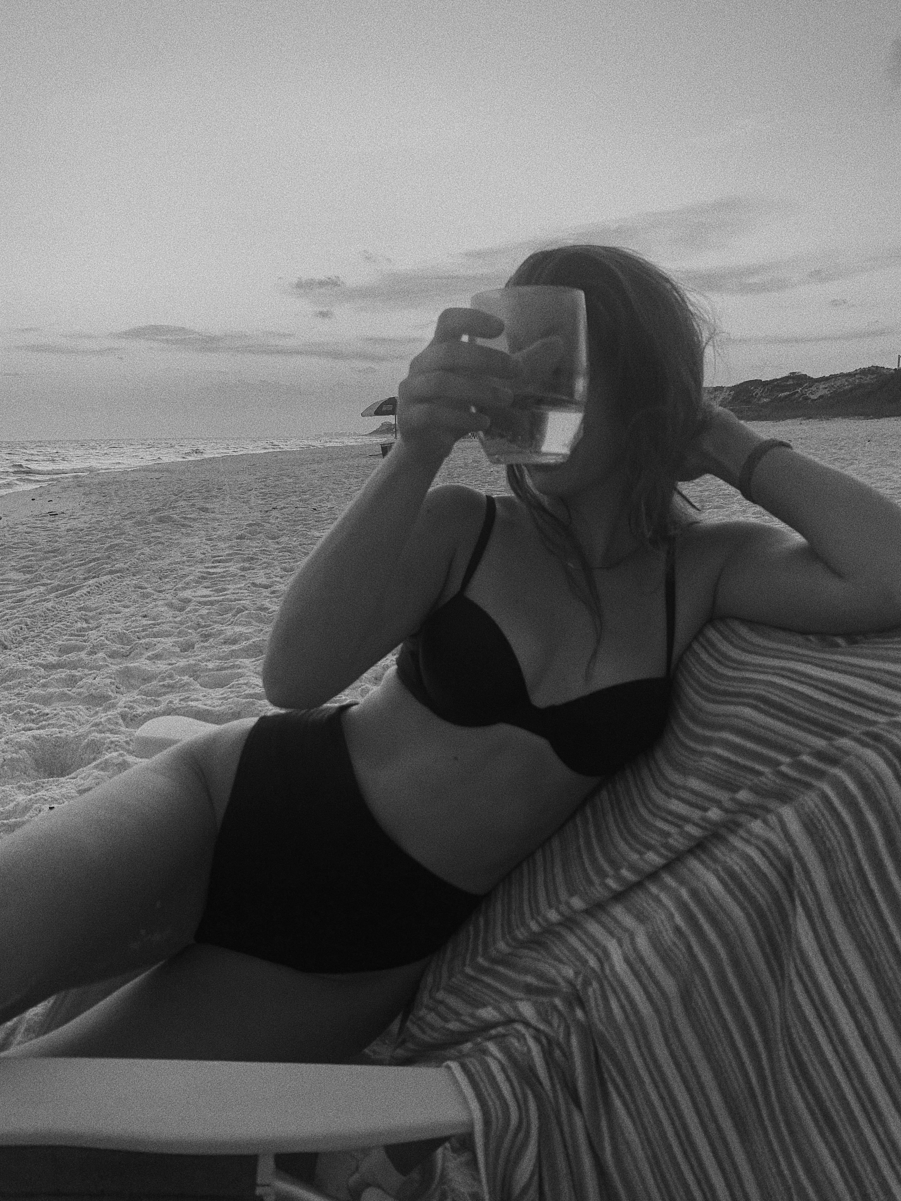 Woman embracing her alcohol-free identity while relaxing in a beach chair, representing the peace found in sobriety Woman embracing her alcohol-free identity while relaxing in a beach chair, representing the peace found in sobriety