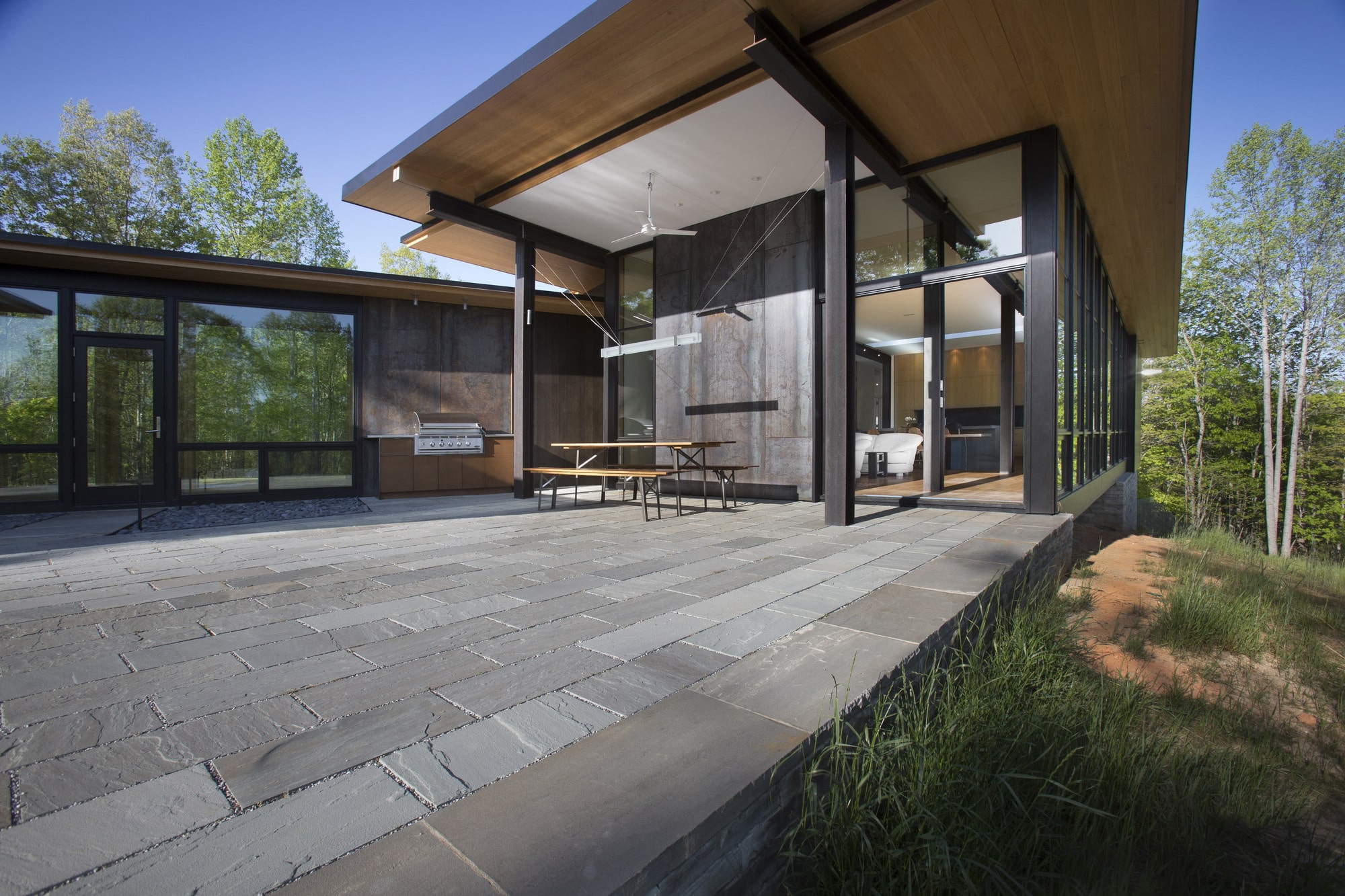 a building with a glass wall and a table