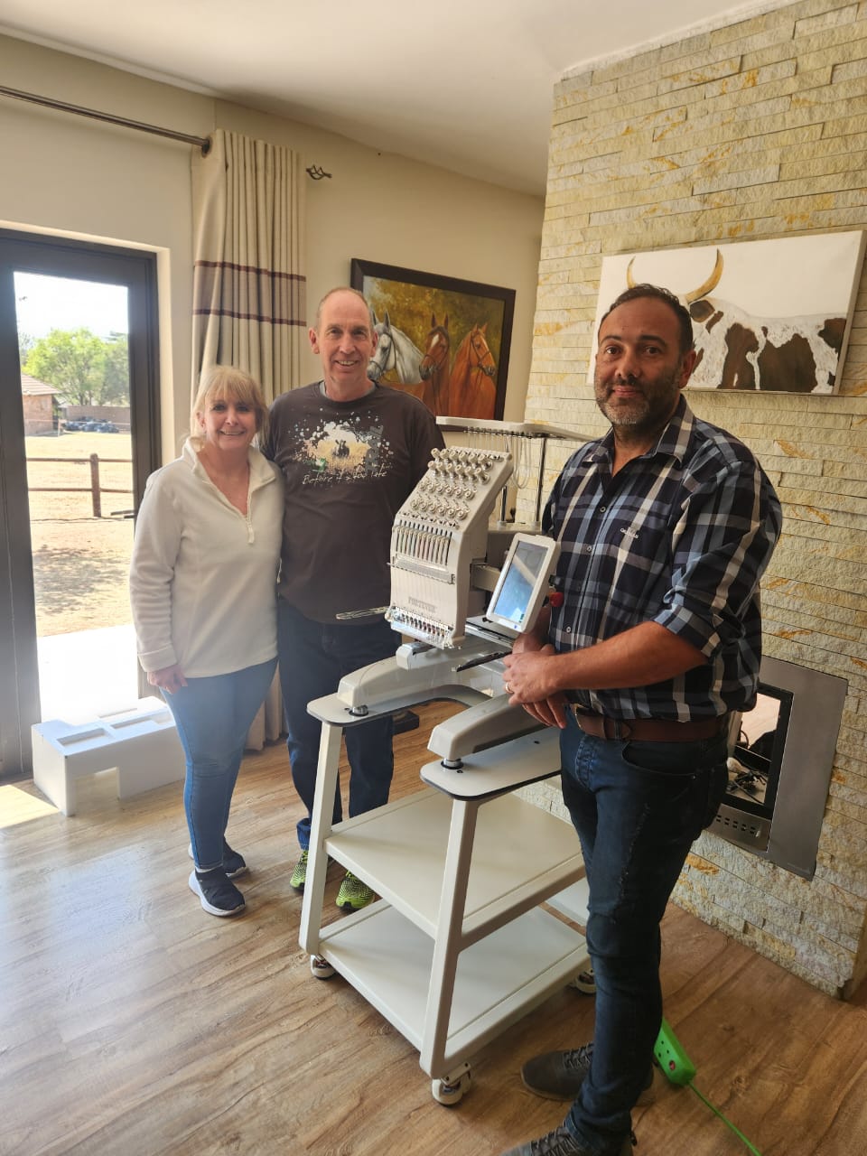 Founder with customer in front of a Fortever embroidery system