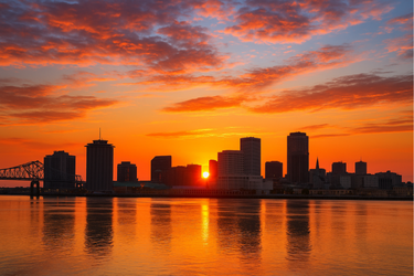 Sunrise over city with cars symbolizing growth and new opportunities for women in automotive. Sunrise over city with cars symbolizing growth and new opportunities for women in automotive.