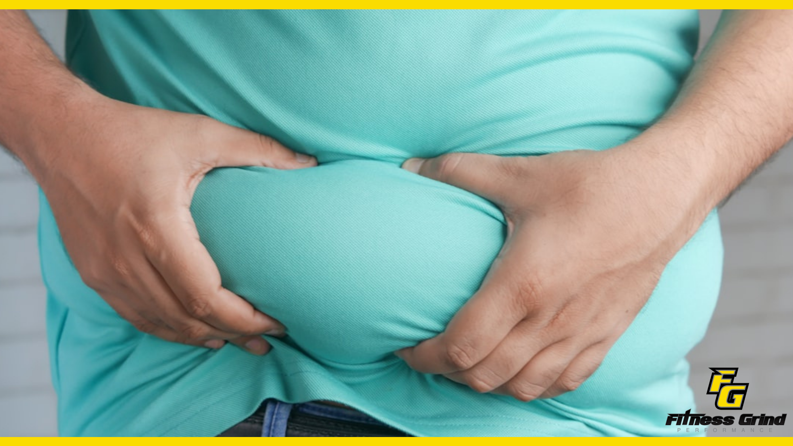 An image of a man clutching his abdomen in discomfort. An image of a man clutching his abdomen in discomfort.