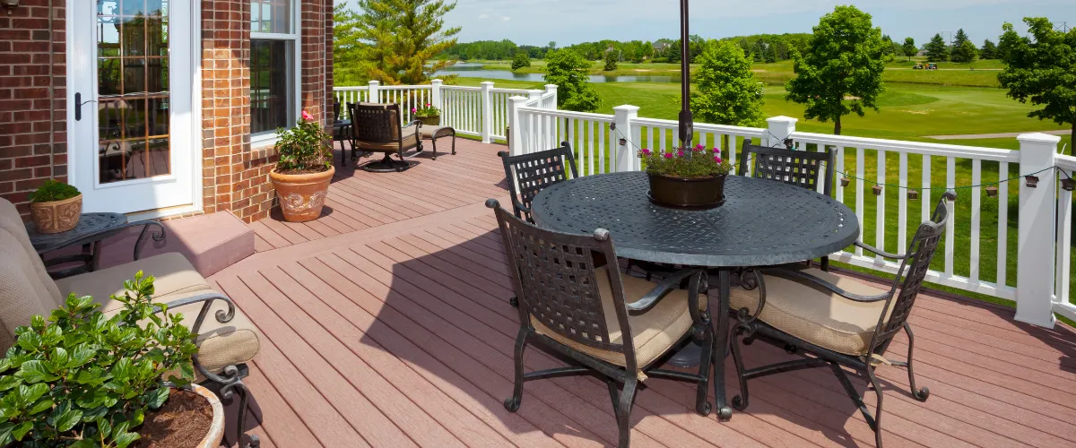 Wet wood deck with pergola and garden accents after rainfall. Wet wood deck with pergola and garden accents after rainfall.