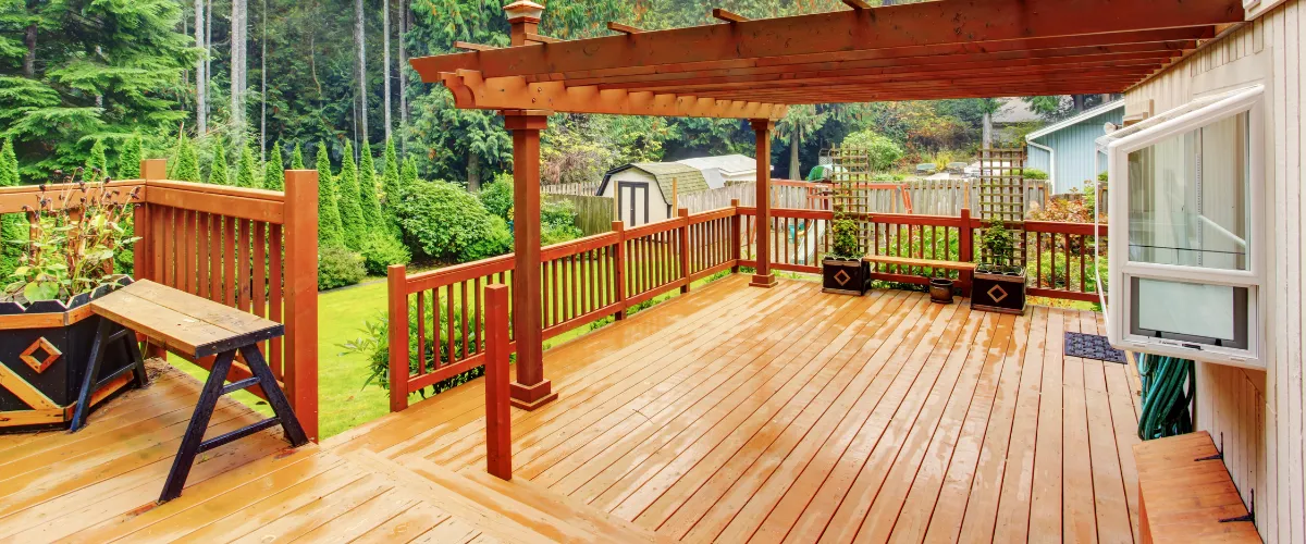 Raised composite deck with patio furniture and scenic golf course views. Raised composite deck with patio furniture and scenic golf course views.