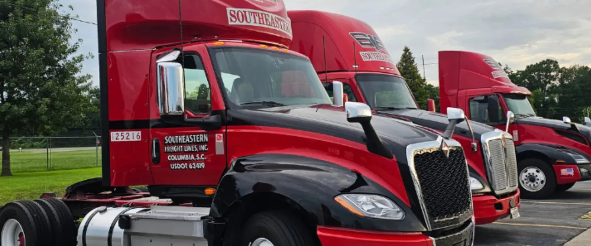 Side view of Southeastern Freight semi-truck fleet with clean polished exteriors Side view of Southeastern Freight semi-truck fleet with clean polished exteriors