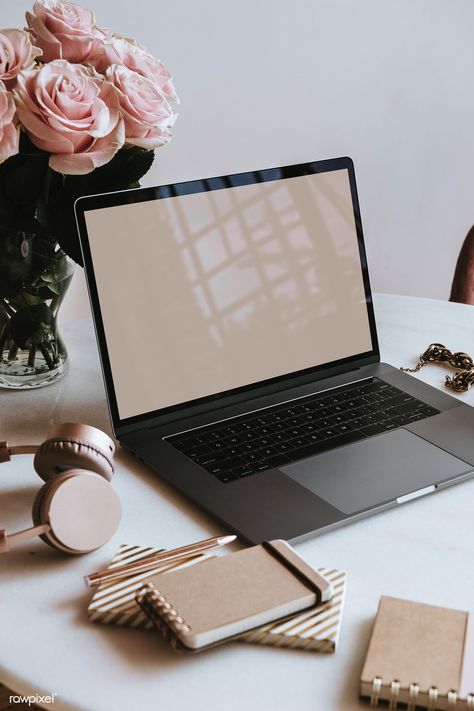 Minimalist workspace with flower and laptop symbolizing balance in business