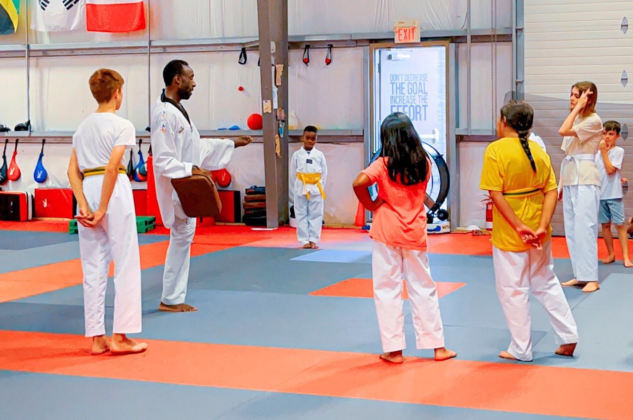 Martial arts instructor with kids