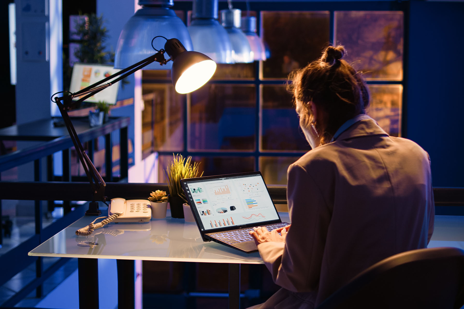 Content creator working with laptop and streaming setup