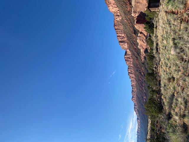 A wall of stone cradling the valley.