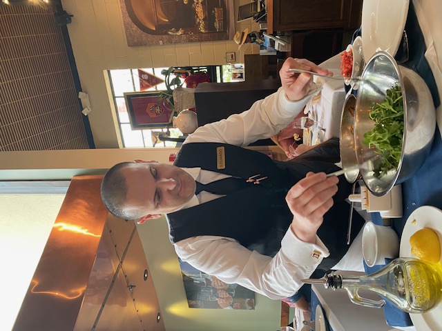Eduardo putting the final touches on my Mom's meal