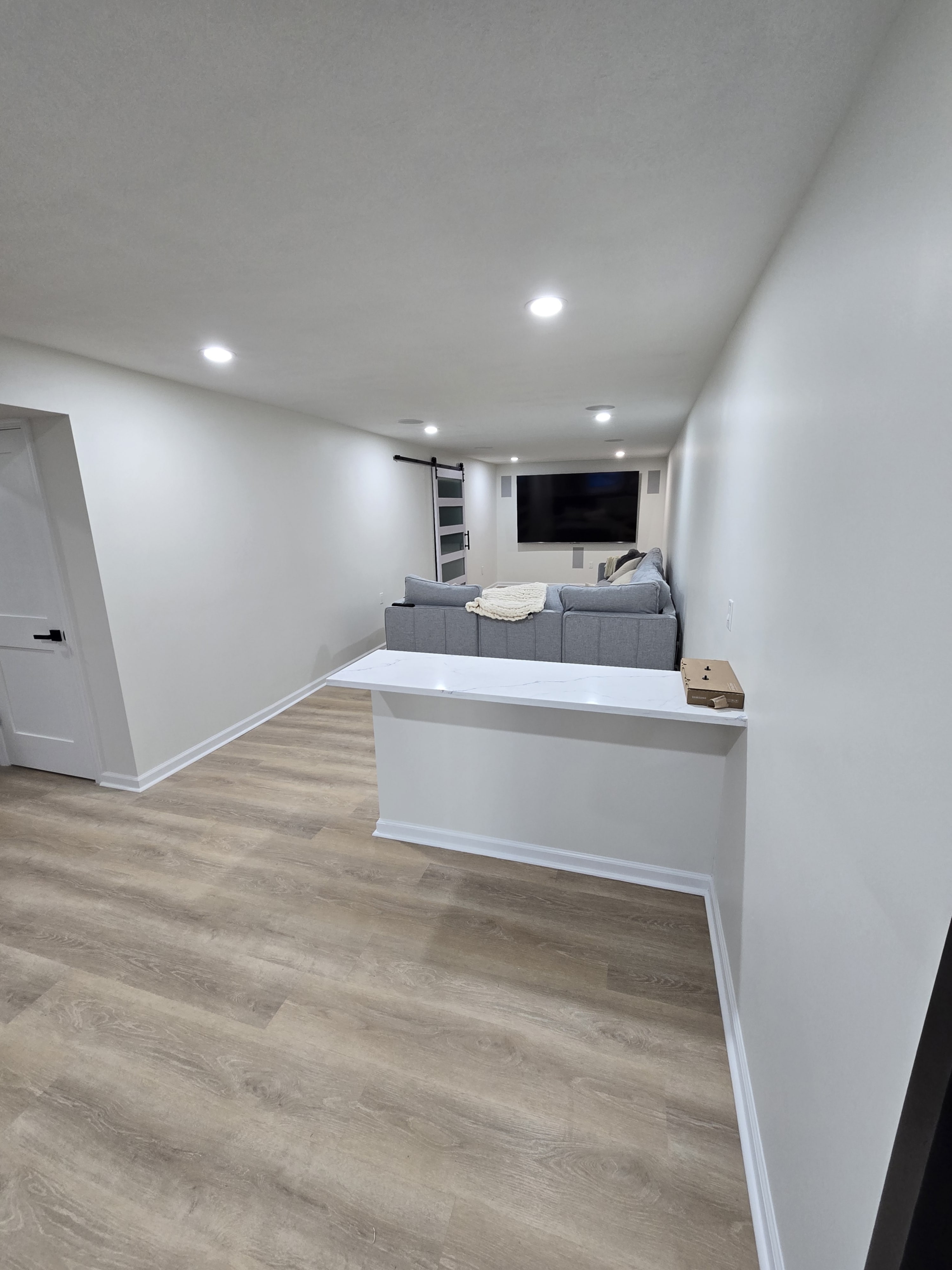 Wide shot of the finished lower level with even lighting