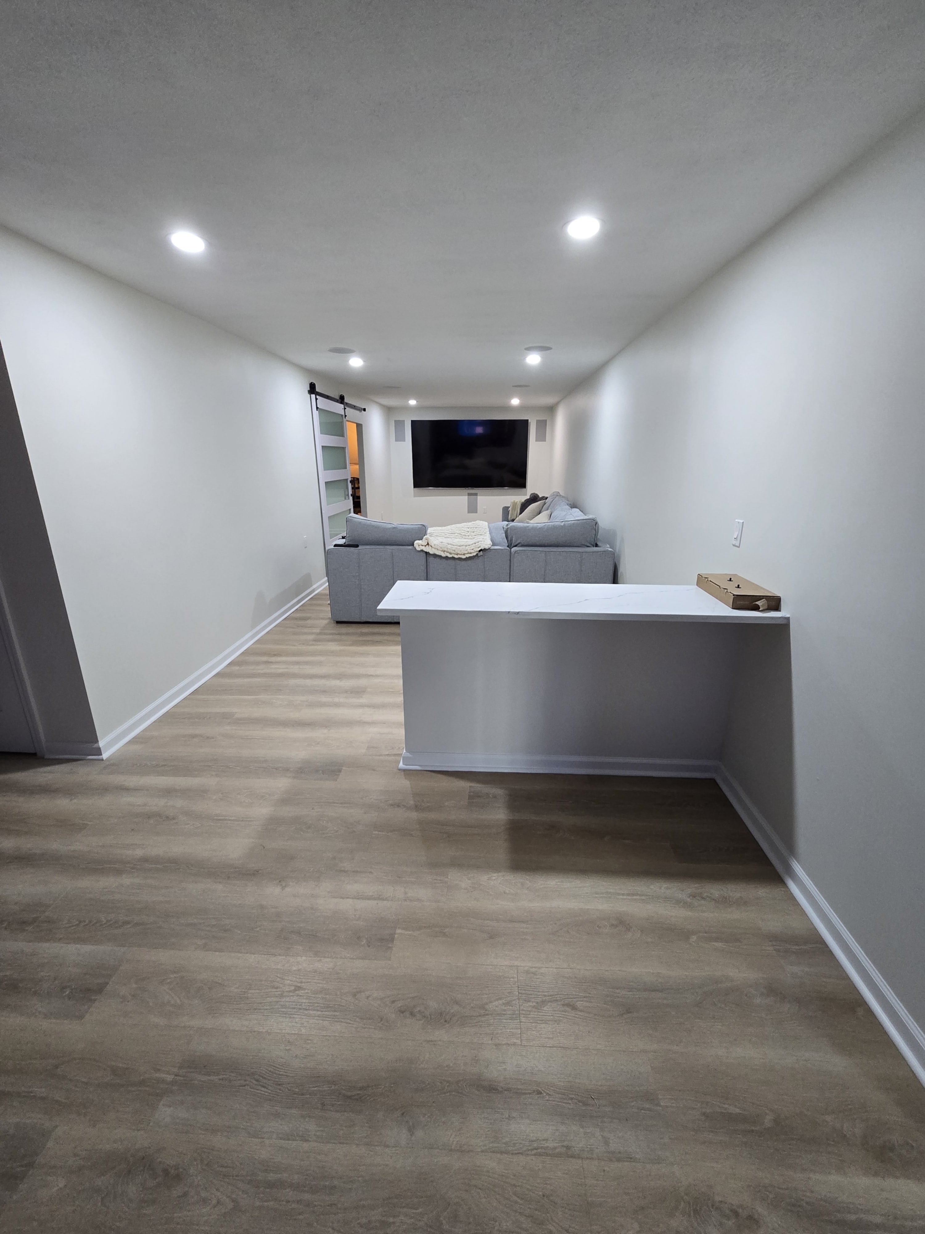 Detail shot of baseboards and fresh paint contrast