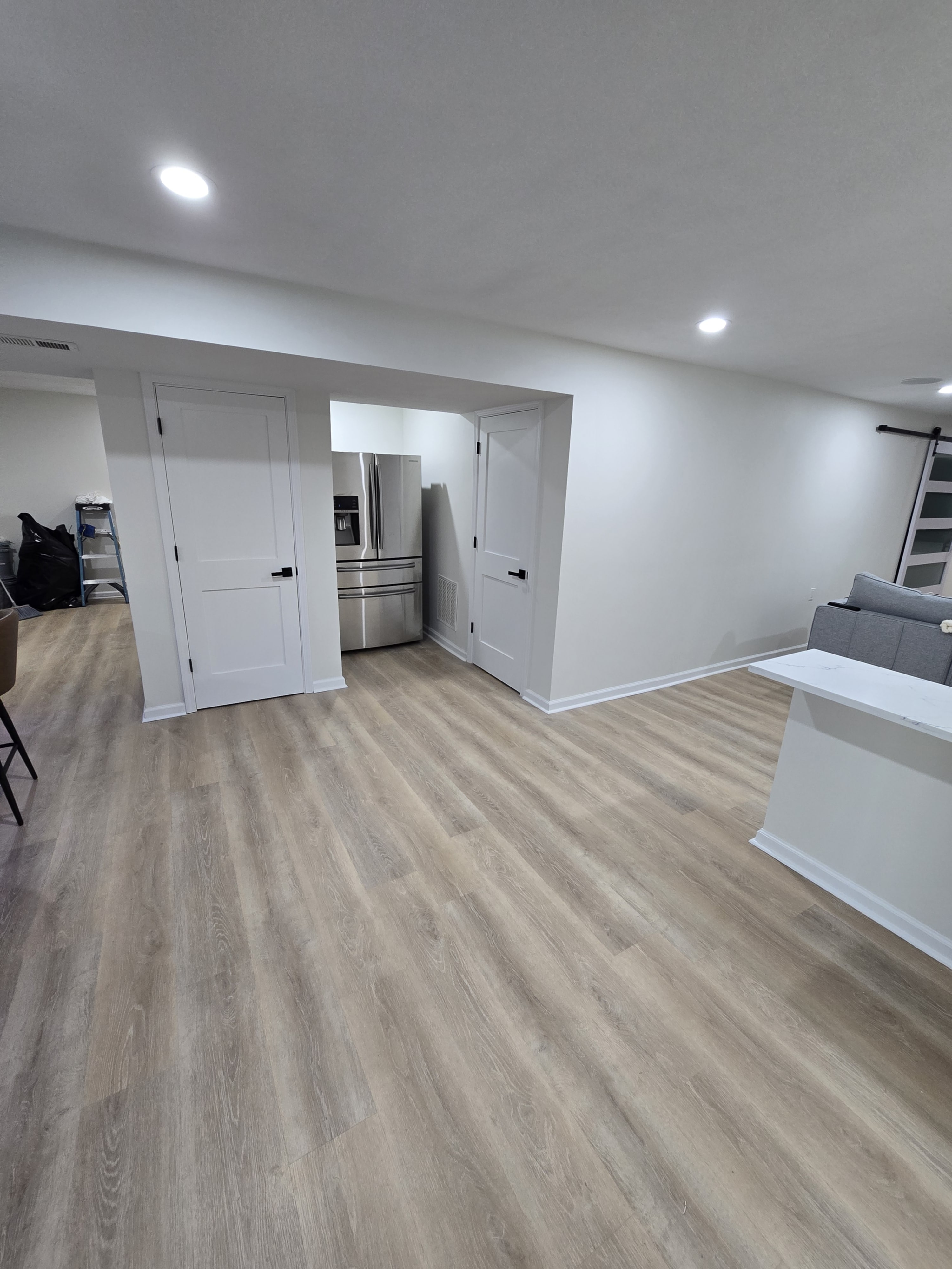 Freshly finished stair landing into the new basement