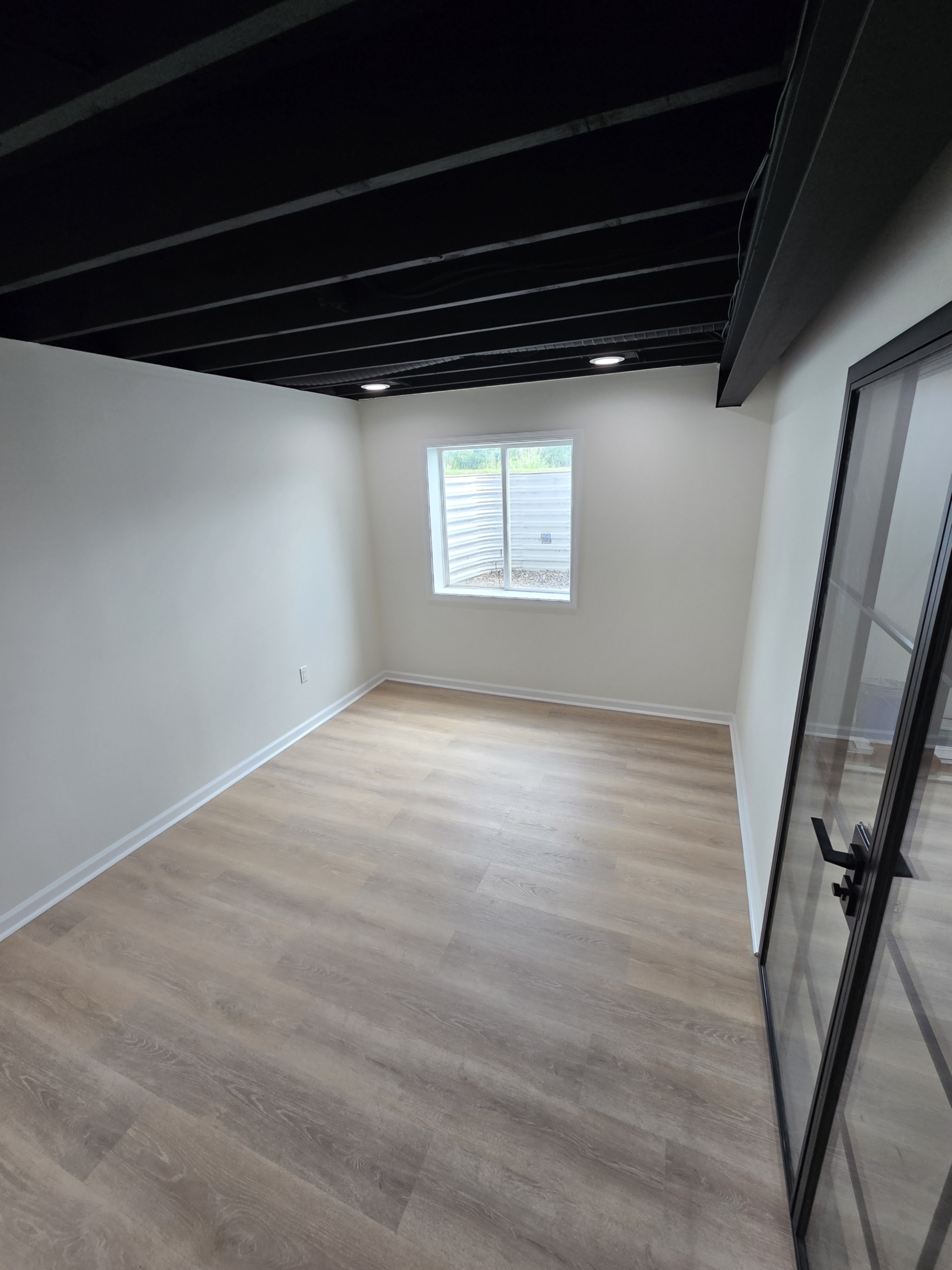 Low-profile ceiling lights creating a bright, even feel