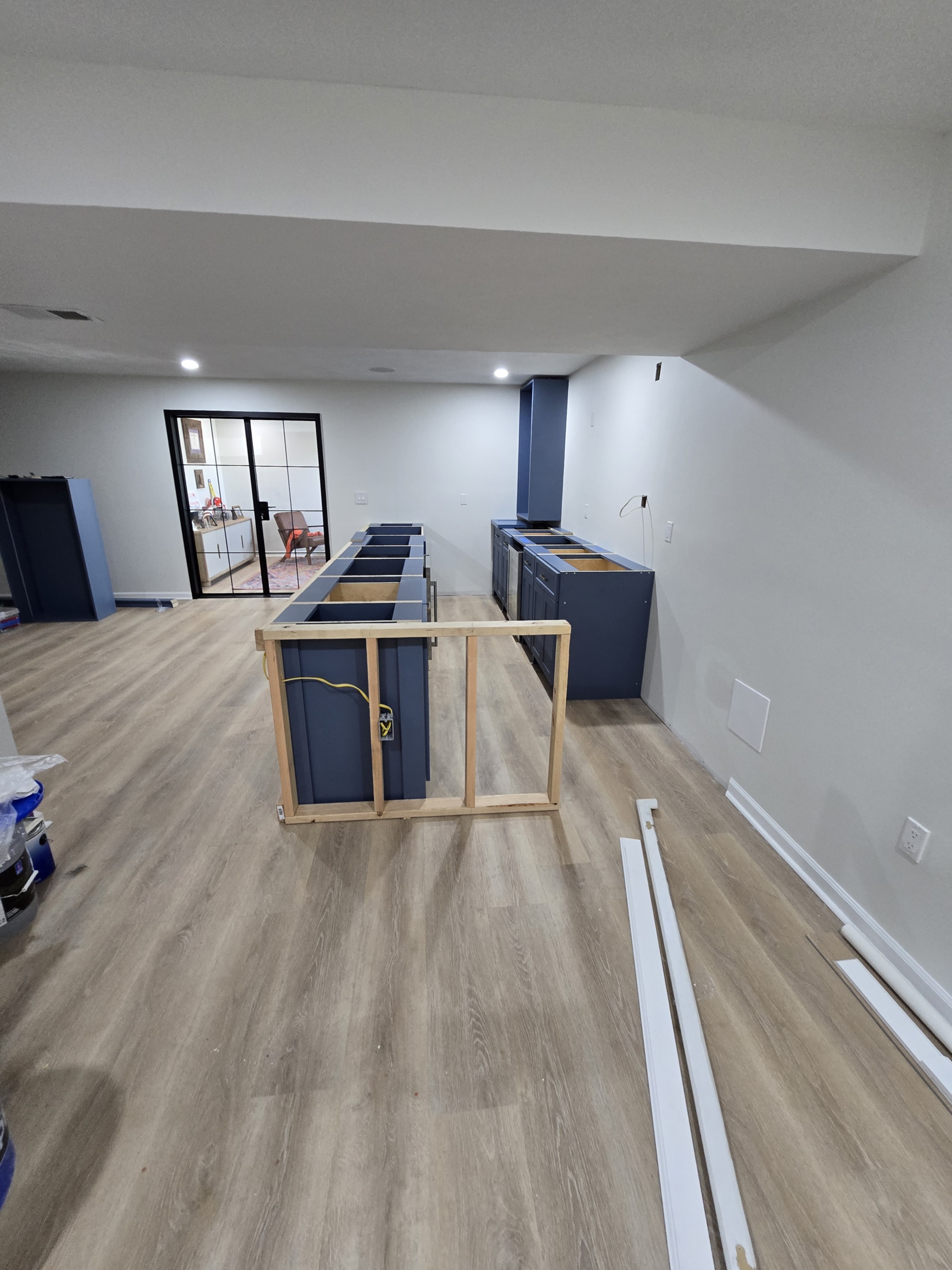 Finished corner with clean paint, trim, and lighting