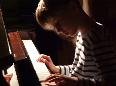 Kid playing piano