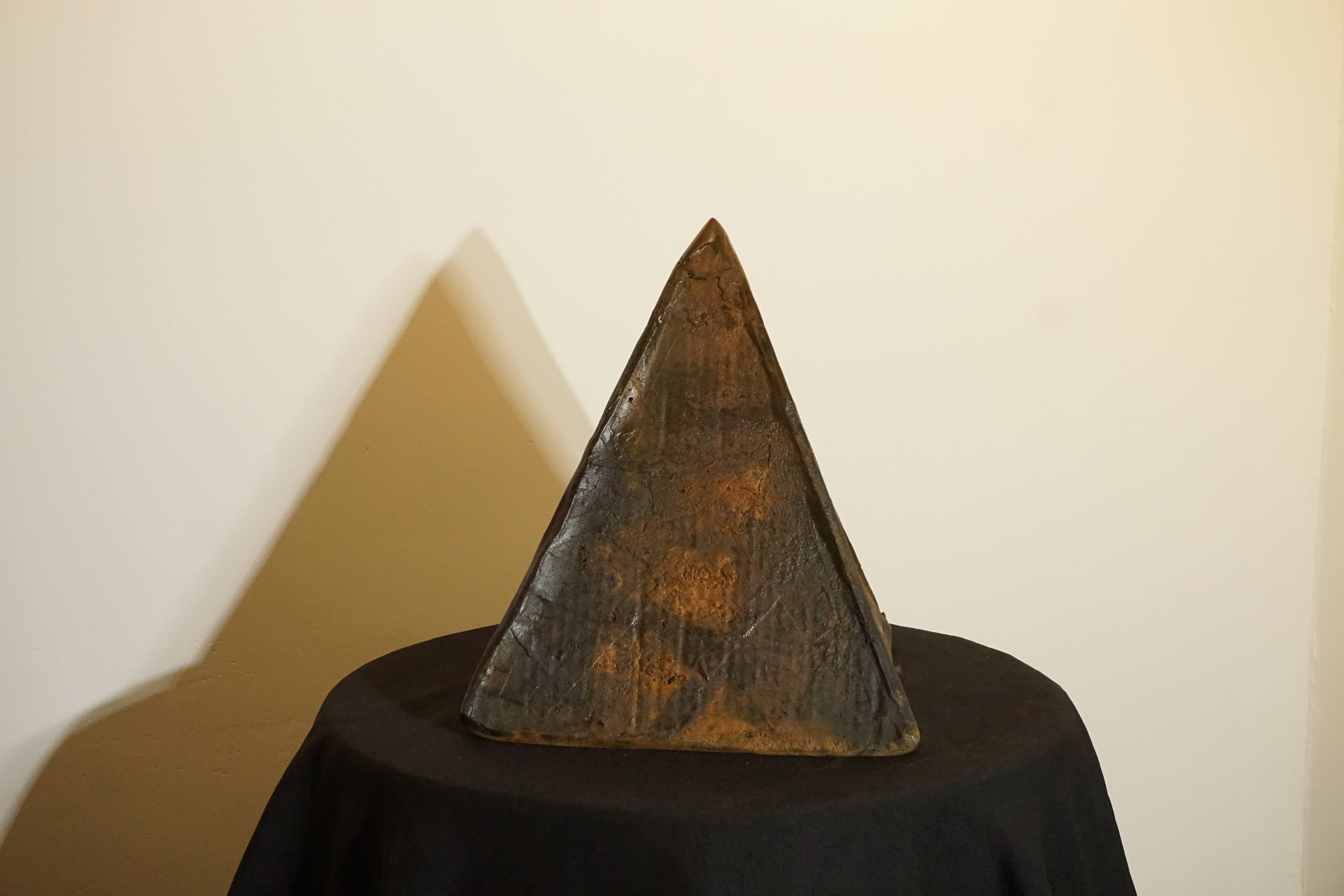 cast iron pyramidal sculpture