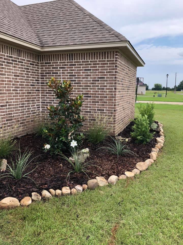 Raised flower bed with colorful blooms in Rayville, LA