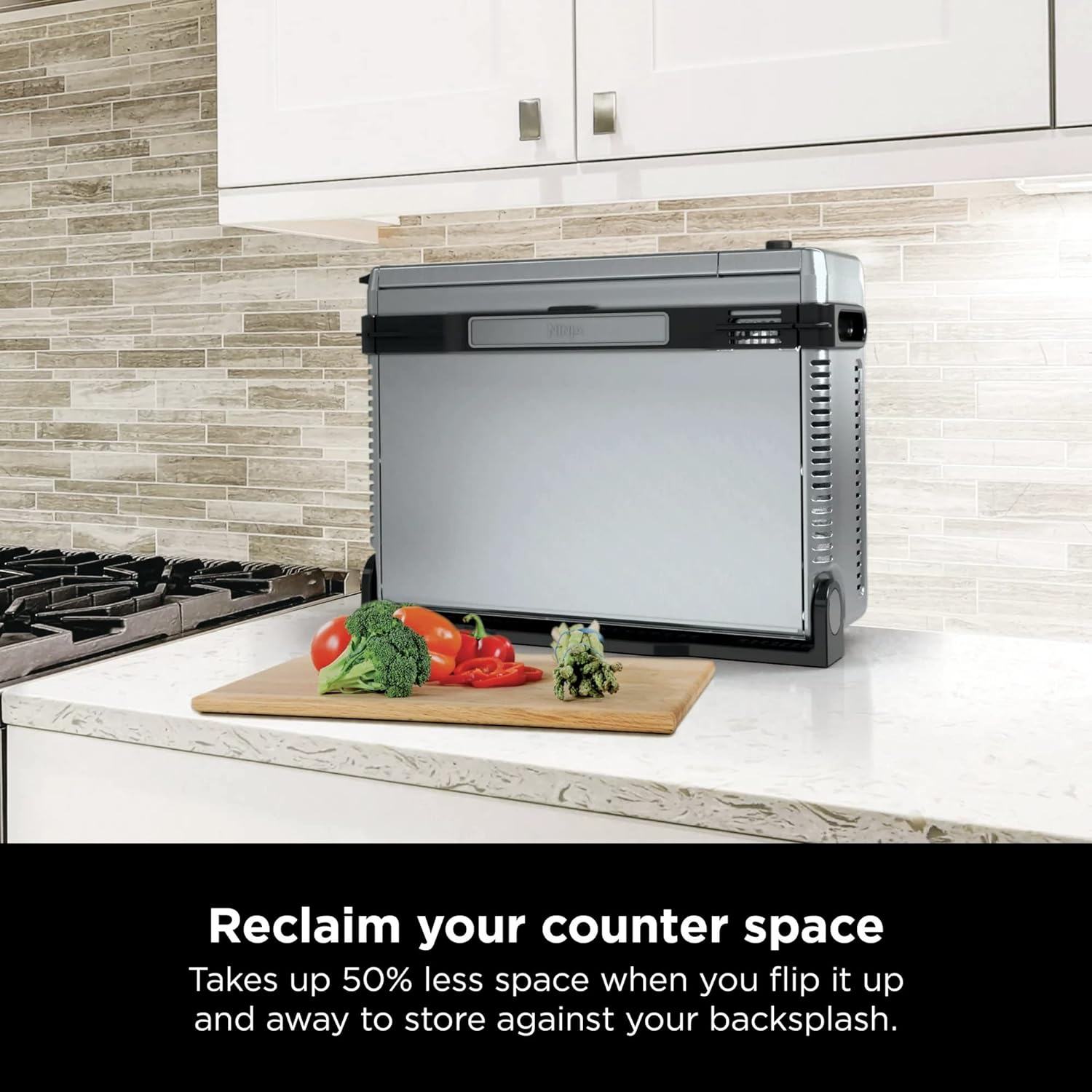 Ninja Air Fryer flipped up on countertop to show space saving capacity Ninja Air Fryer flipped up on countertop to show space saving capacity