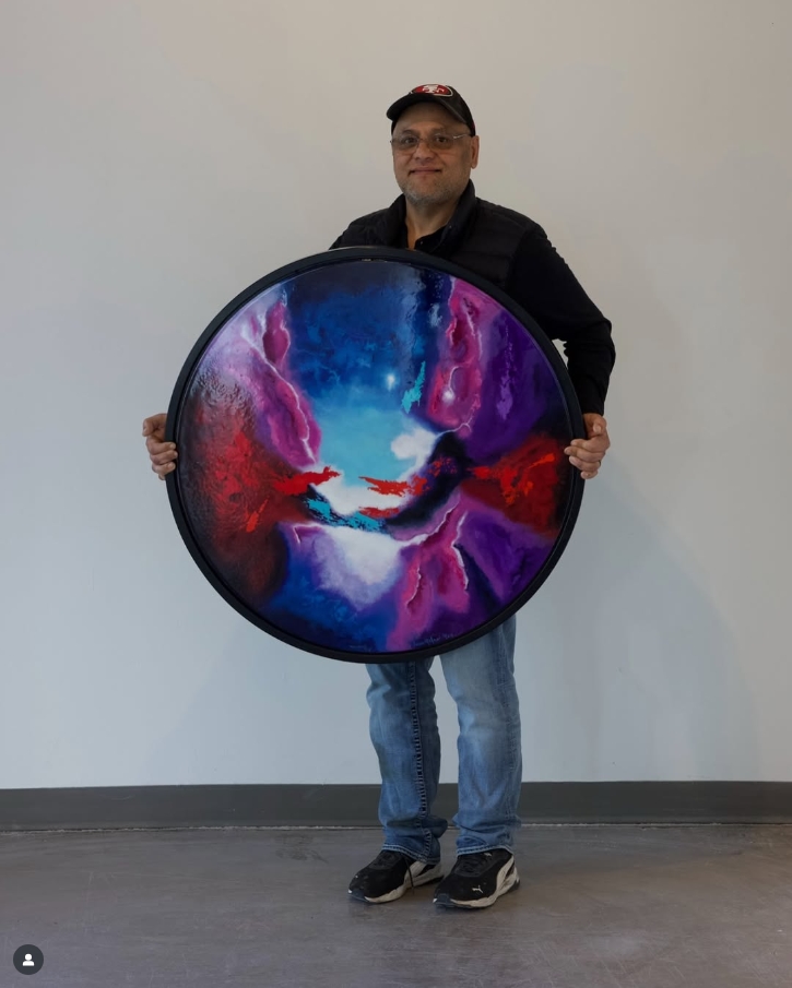 artist javier moreno holding his piece "The unknown" that is displayed at create gallery and frames a fine art and custom frame shop in garden city idaho artist javier moreno holding his piece "The unknown" that is displayed at create gallery and frames a fine art and custom frame shop in garden city idaho