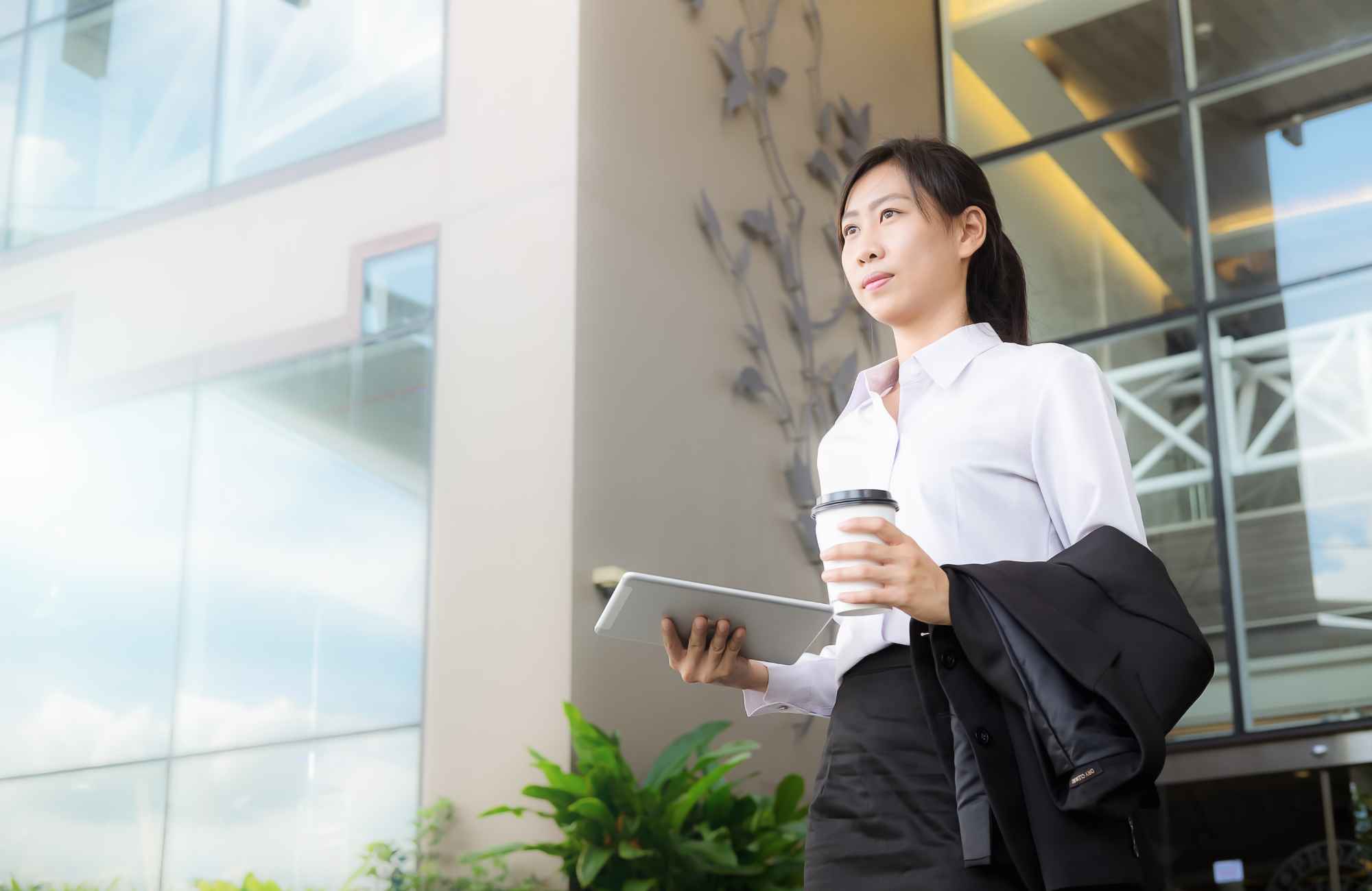 professional-home-organizer-overland-park-ks-time-blocking-tips-for-productivity-professional-woman-leaving-office-building-trustworthy