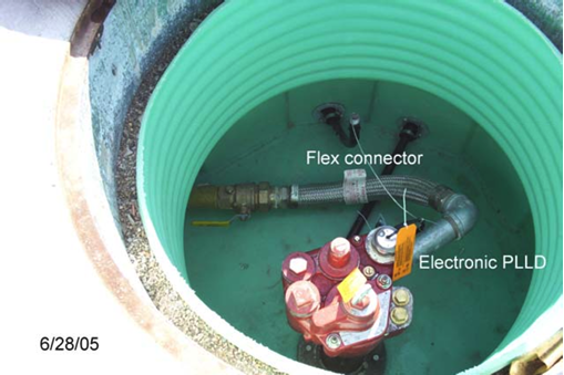 Showing an electronic line leak detector and flexible connector