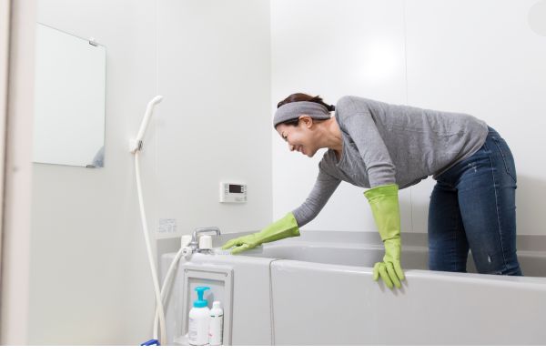 lady cleaning bathtub lady cleaning bathtub