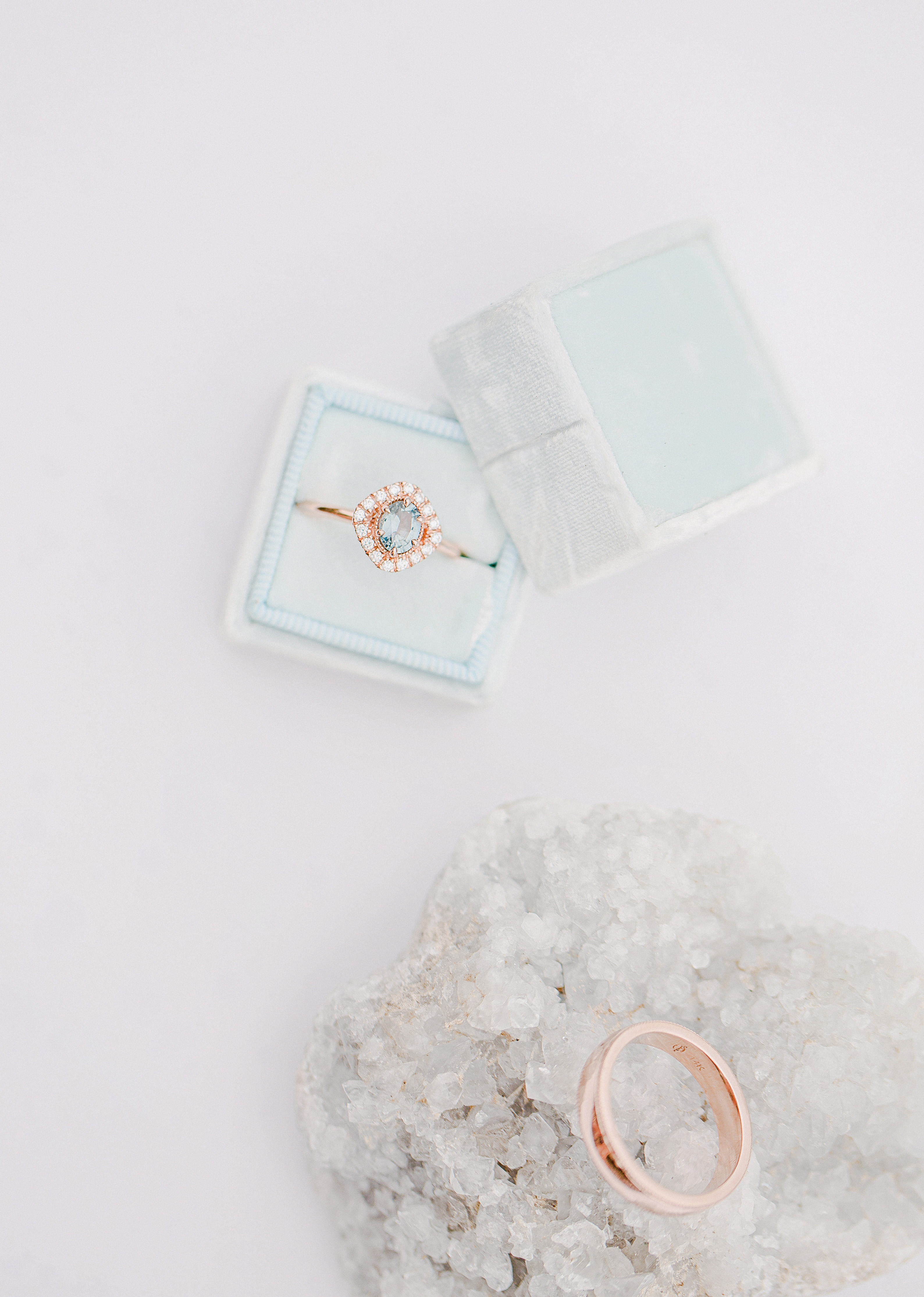 light and airy wedding ring detail photo with light blue engagement ring center stone and crystal quartz detail