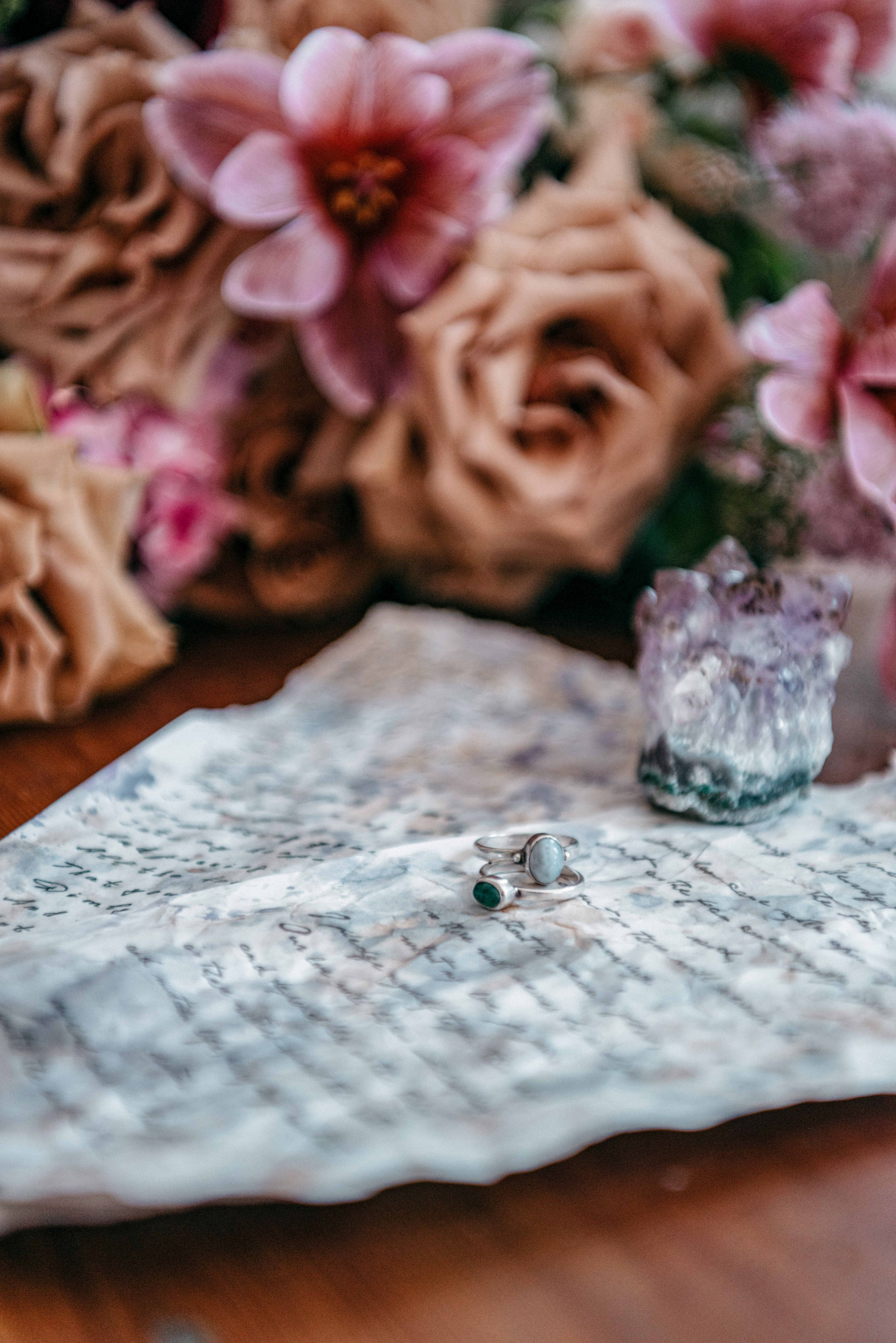 hand written vows with unique engagement rings, amethyst crystal and bridal bouquet