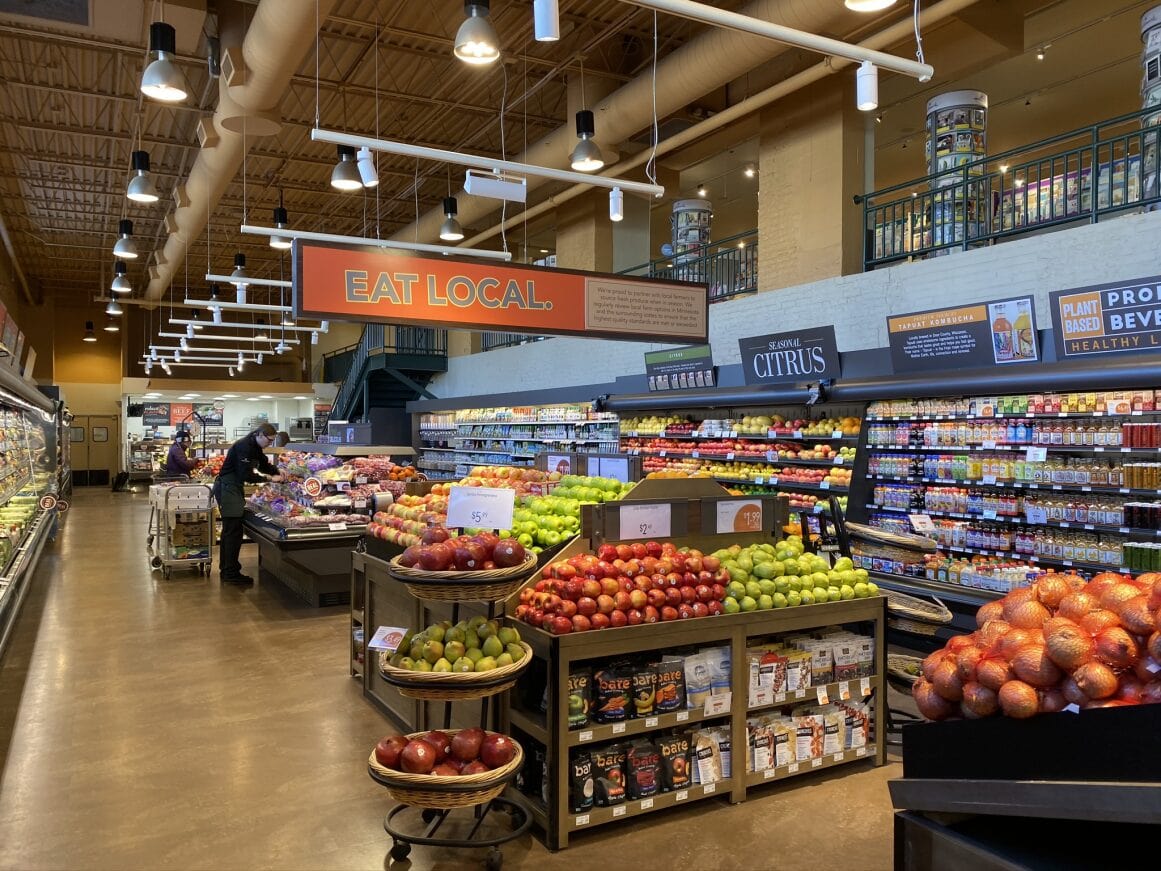 a grocery store with fruits and vegetables