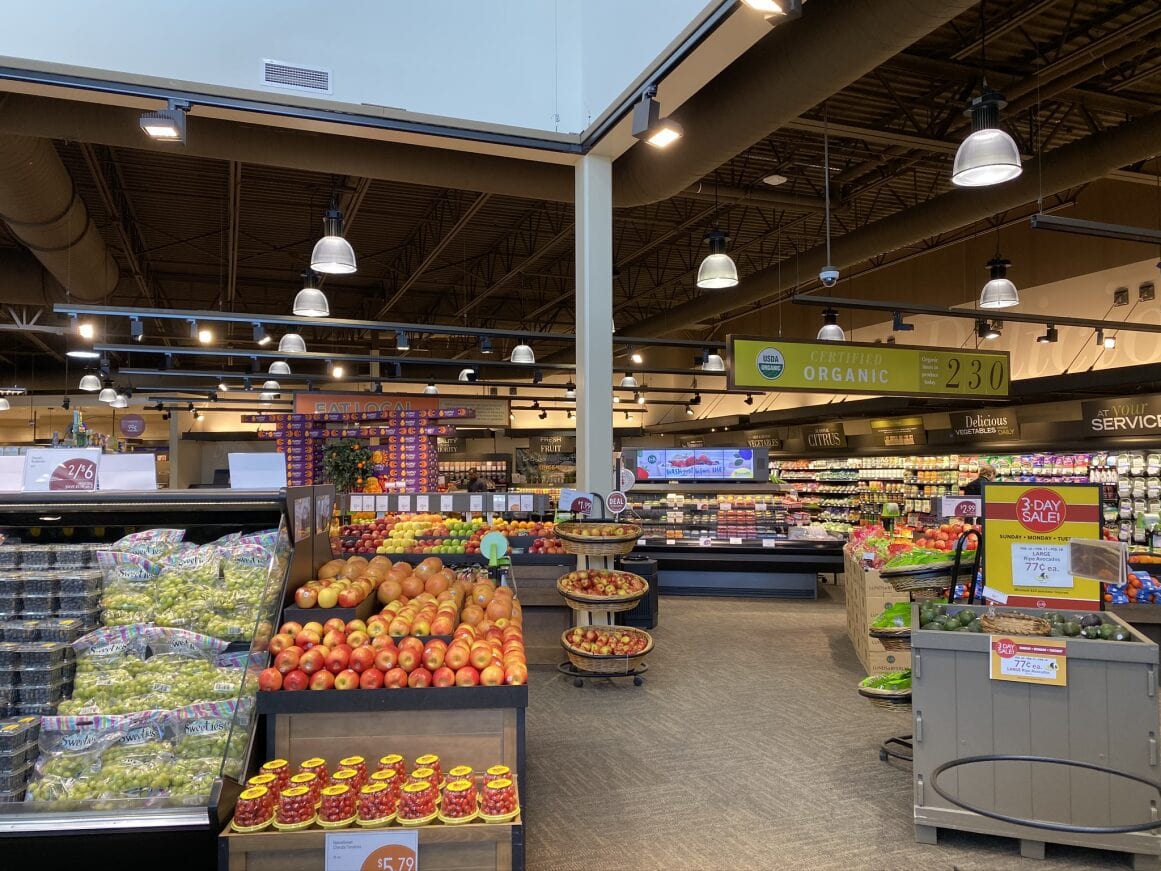 a grocery store with lots of fruits