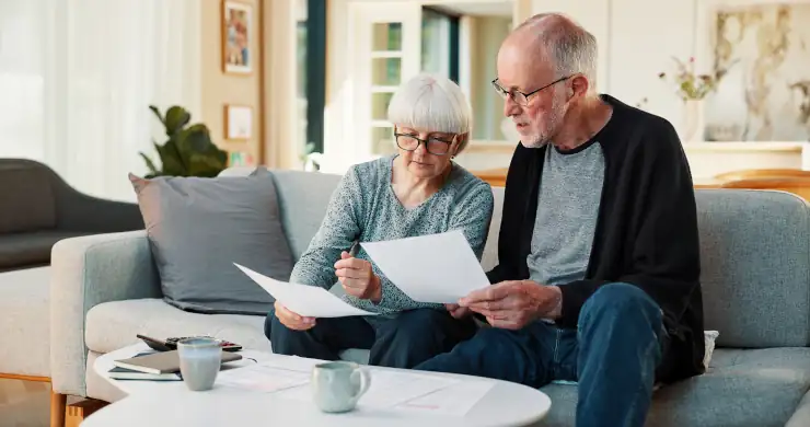Senior couple with documents for budget planning