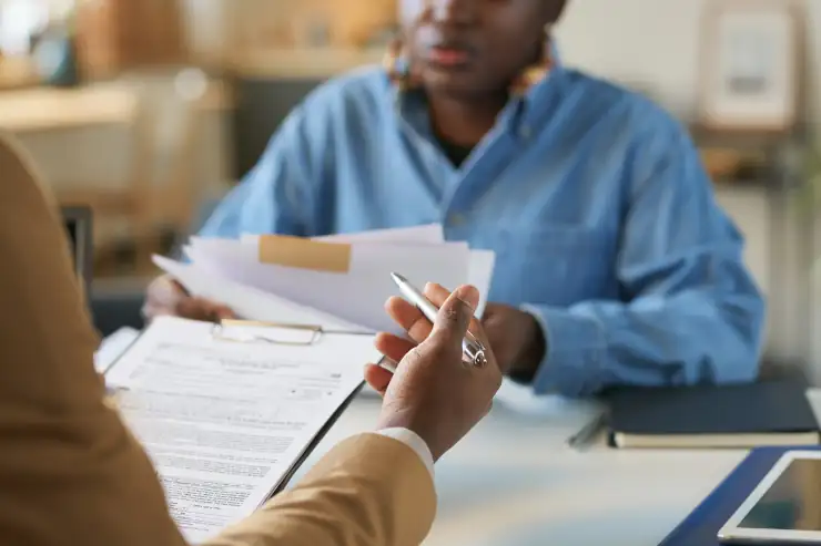 Two people looking over documents