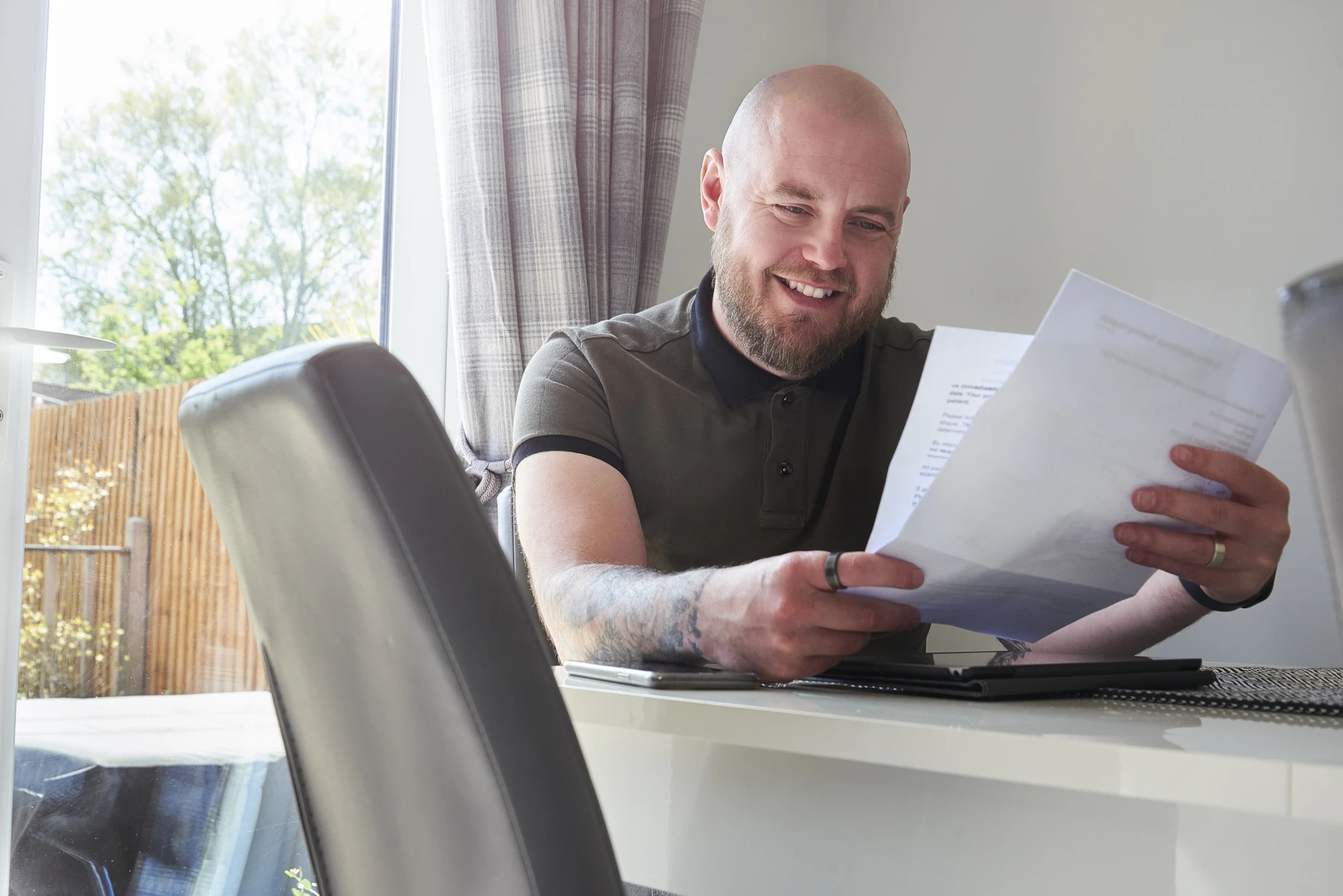 Man happy about saving money after consolidating debt