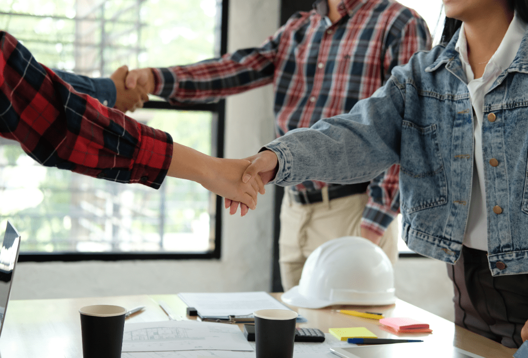 people shaking hands in a room