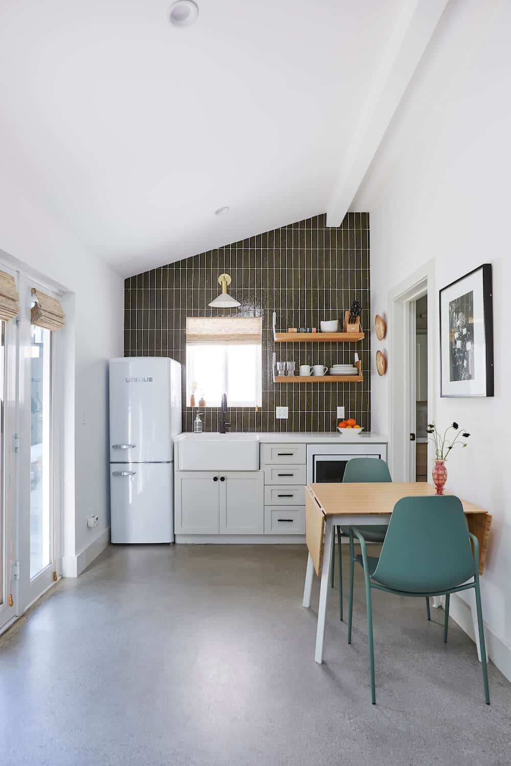 a kitchen with a table and chairs