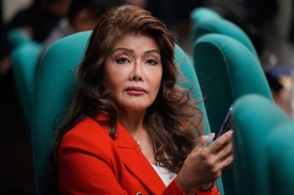 Close-up of Senator Imee Marcos with a headline stating that constitutional experts say her drug allegations are not grounds for impeachment. Close-up of Senator Imee Marcos with a headline stating that constitutional experts say her drug allegations are not grounds for impeachment.