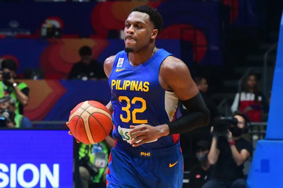 Justin Brownlee in a Gilas Pilipinas jersey raising the ball while defended by an opponent during a previous SEA Games match. Justin Brownlee in a Gilas Pilipinas jersey raising the ball while defended by an opponent during a previous SEA Games match.