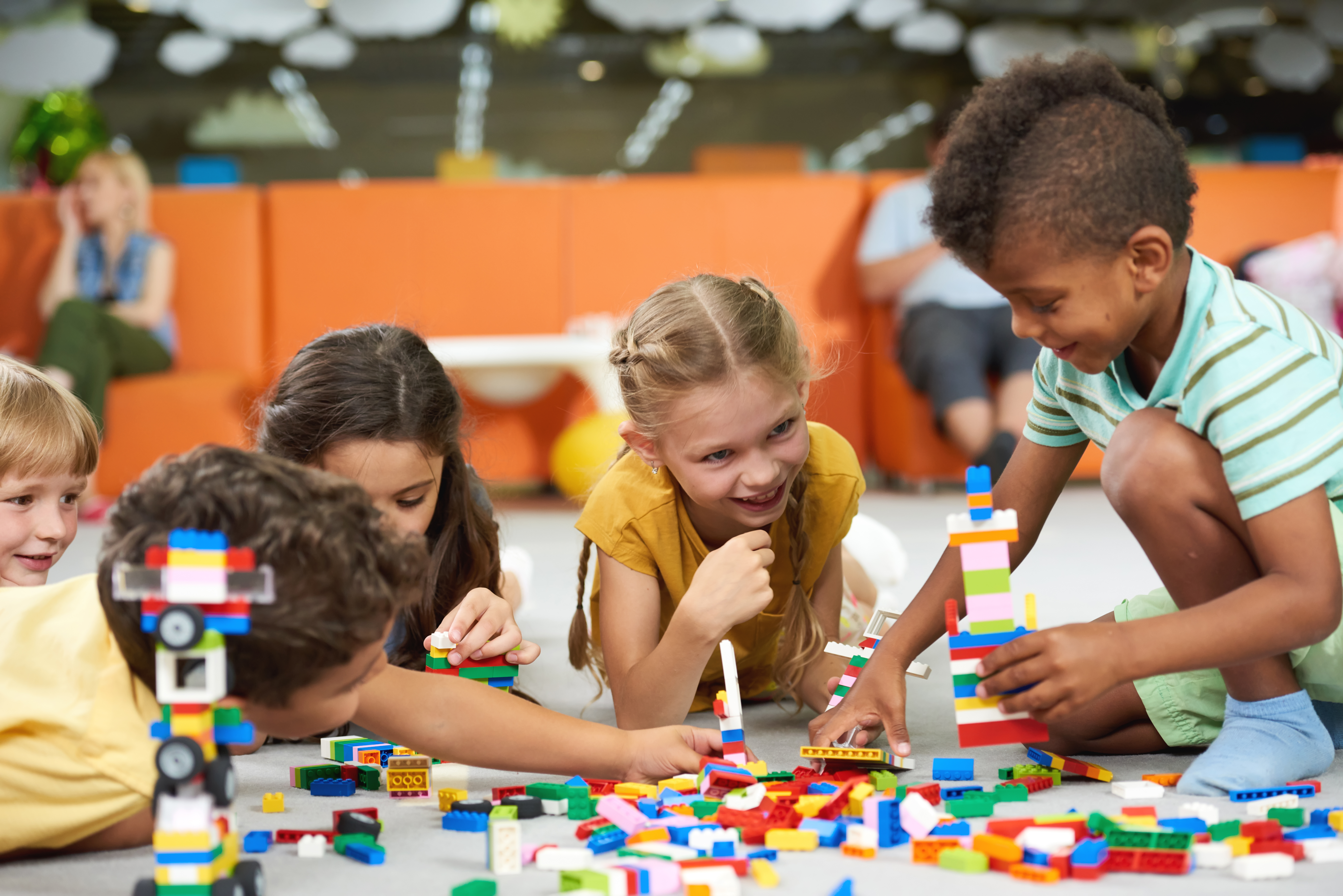 Children of different ages and backgrounds playing together cooperatively. Children of different ages and backgrounds playing together cooperatively.